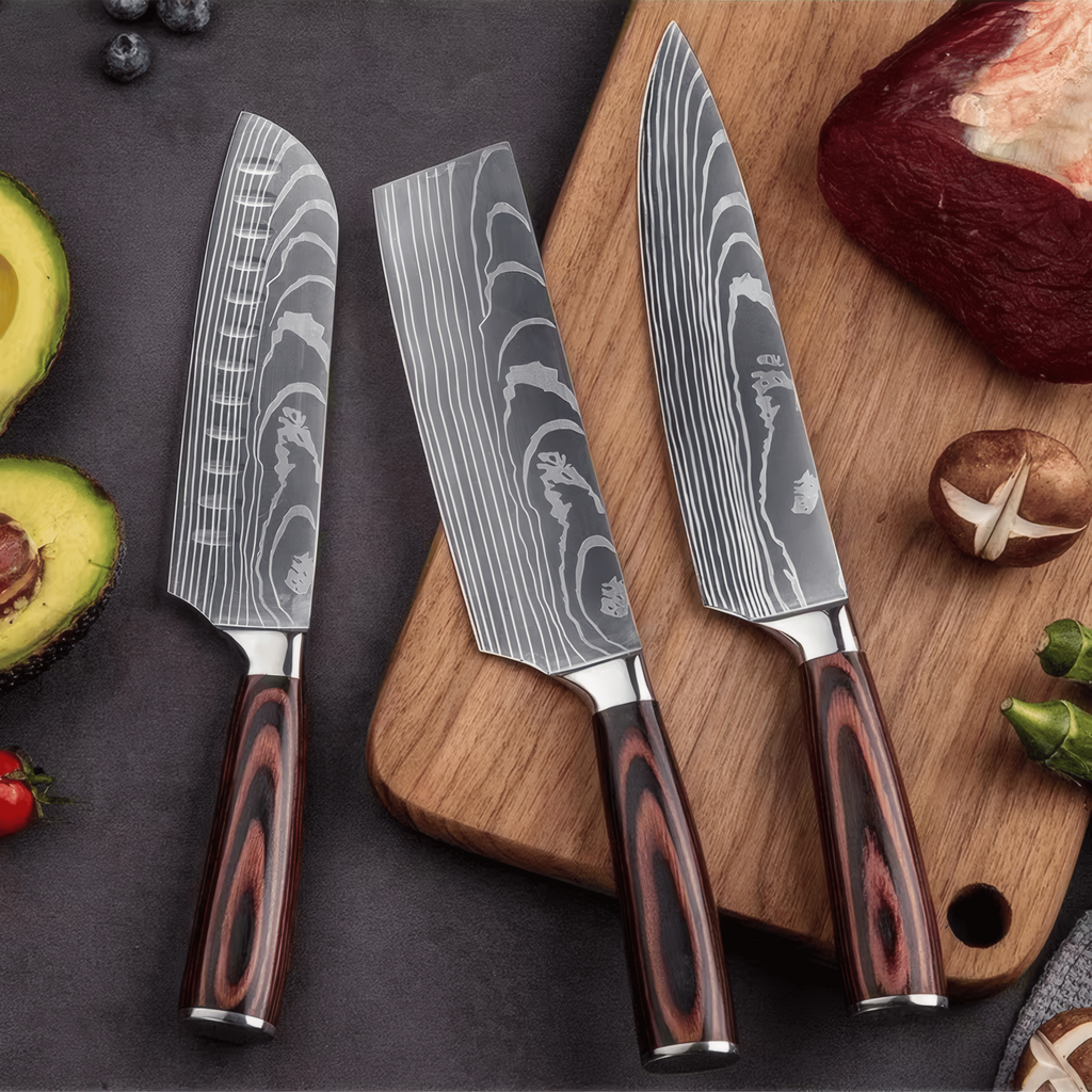Three chef's knives with wooden handles on a cutting board with vegetables.