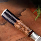 Wooden-handled knife with a silver blade on a wooden surface