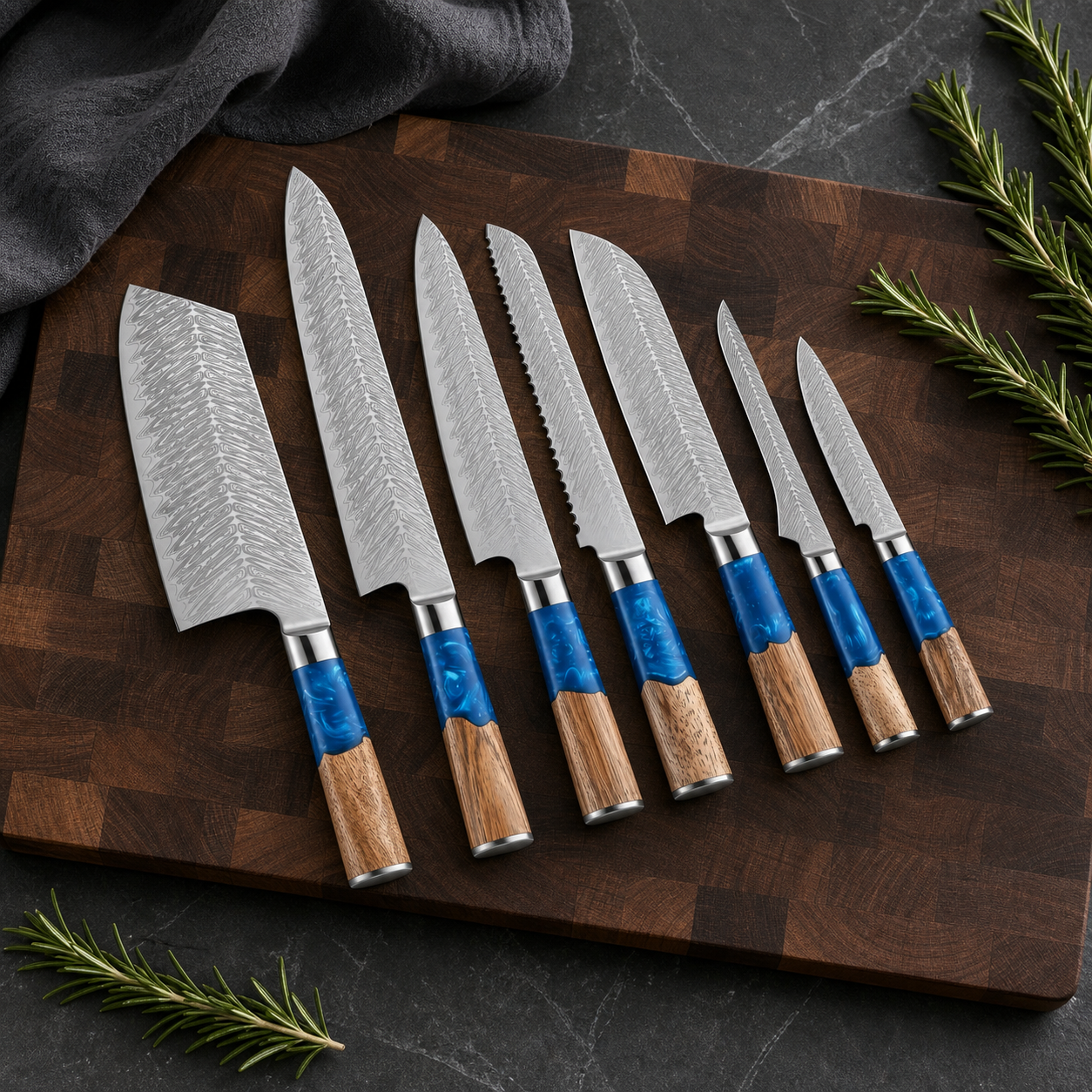 Seven-piece blue resin and wood handle Damascus knife set on a dark walnut board