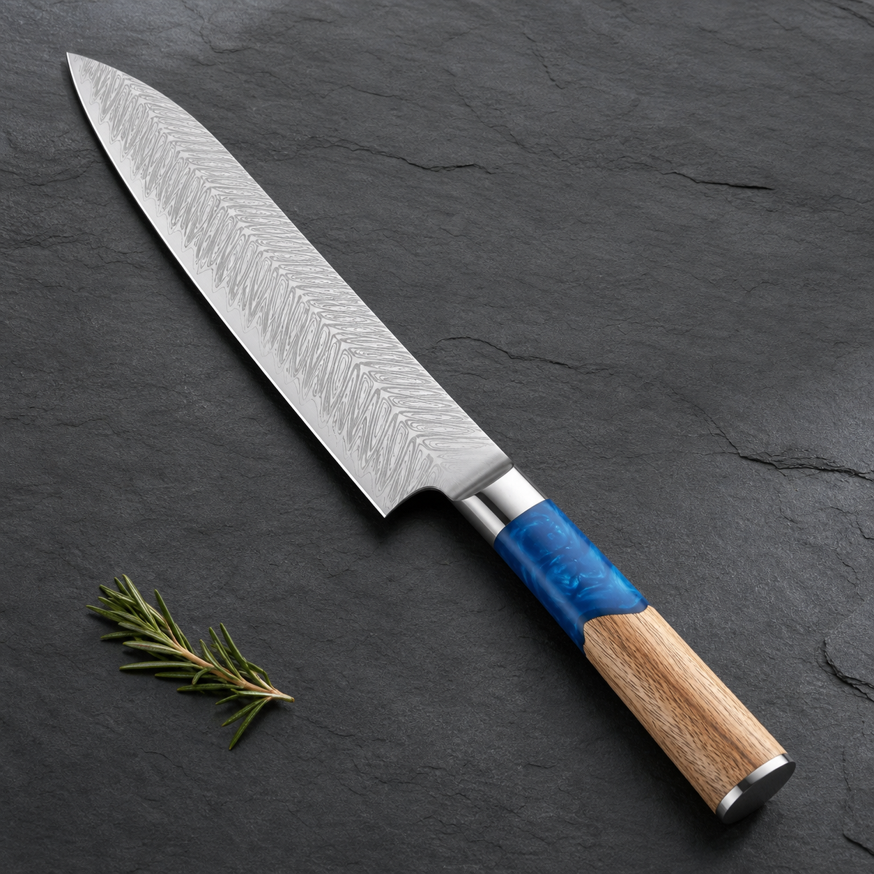 Aokaze Damascus chef knife with a blue resin and wood handle on dark stone