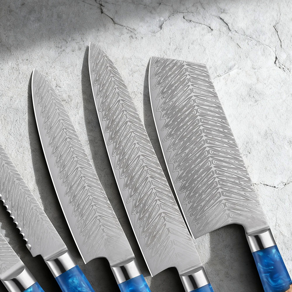 Close-up of feather-pattern Damascus blades in the Aokaze knife set