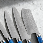 Close-up of feather-pattern Damascus blades in the Aokaze knife set