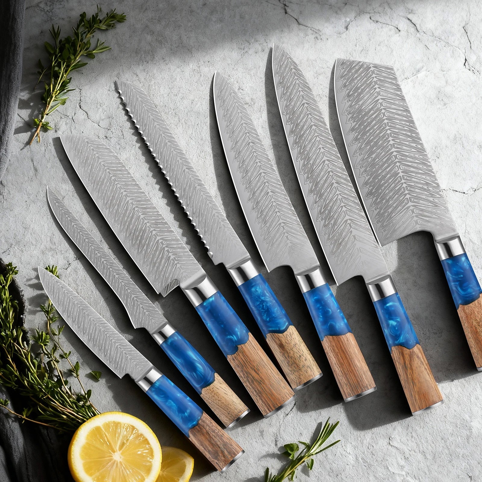 Seven-piece Aokaze Damascus kitchen knife set on a stone surface with herbs and lemon